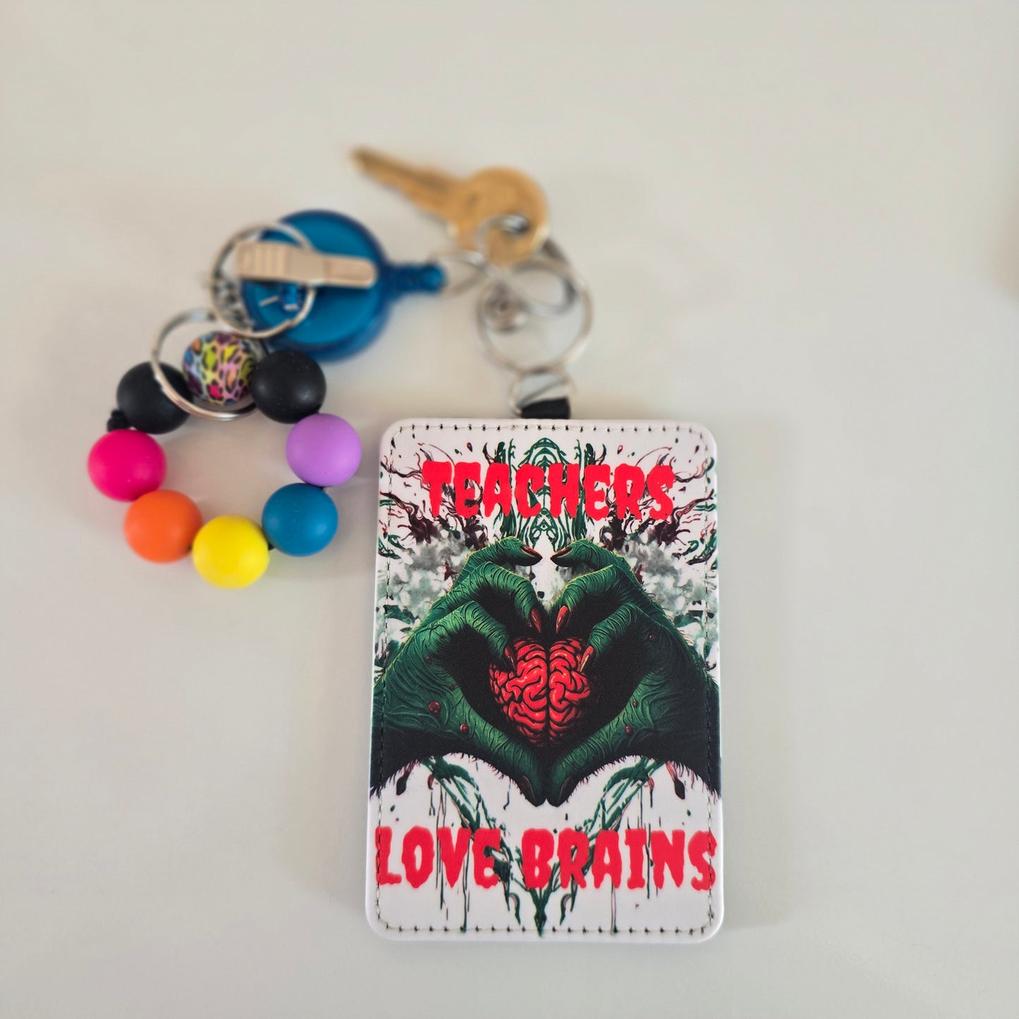 Teachers love brains badge holder